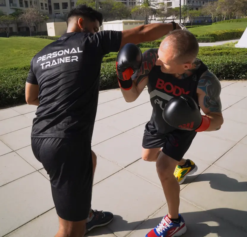 FlexAndPunch fitness trainers displaying boxing jabs and defence