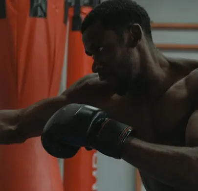 FlexAndPunch closeup of a man punching the punching bag during boxing training